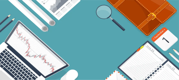 Flat lay of business tools including a laptop with a red trend graph, planner, magnifying glass, and calendar marked September 7.