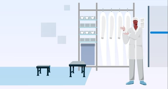 A Cleanroom operator gowning in a cleanroom gown room.