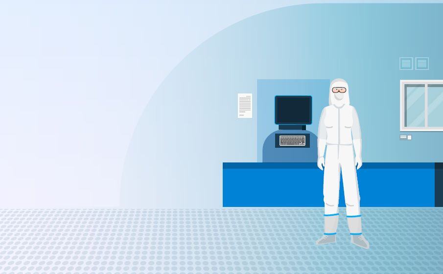 A Cleanroom operator with a full body coverall standing up in a cleanroom.