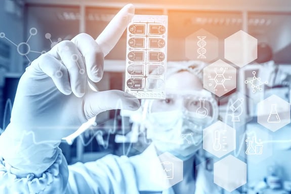 A Cleanroom operators wearing gloves and face coverall working in a cleanroom.